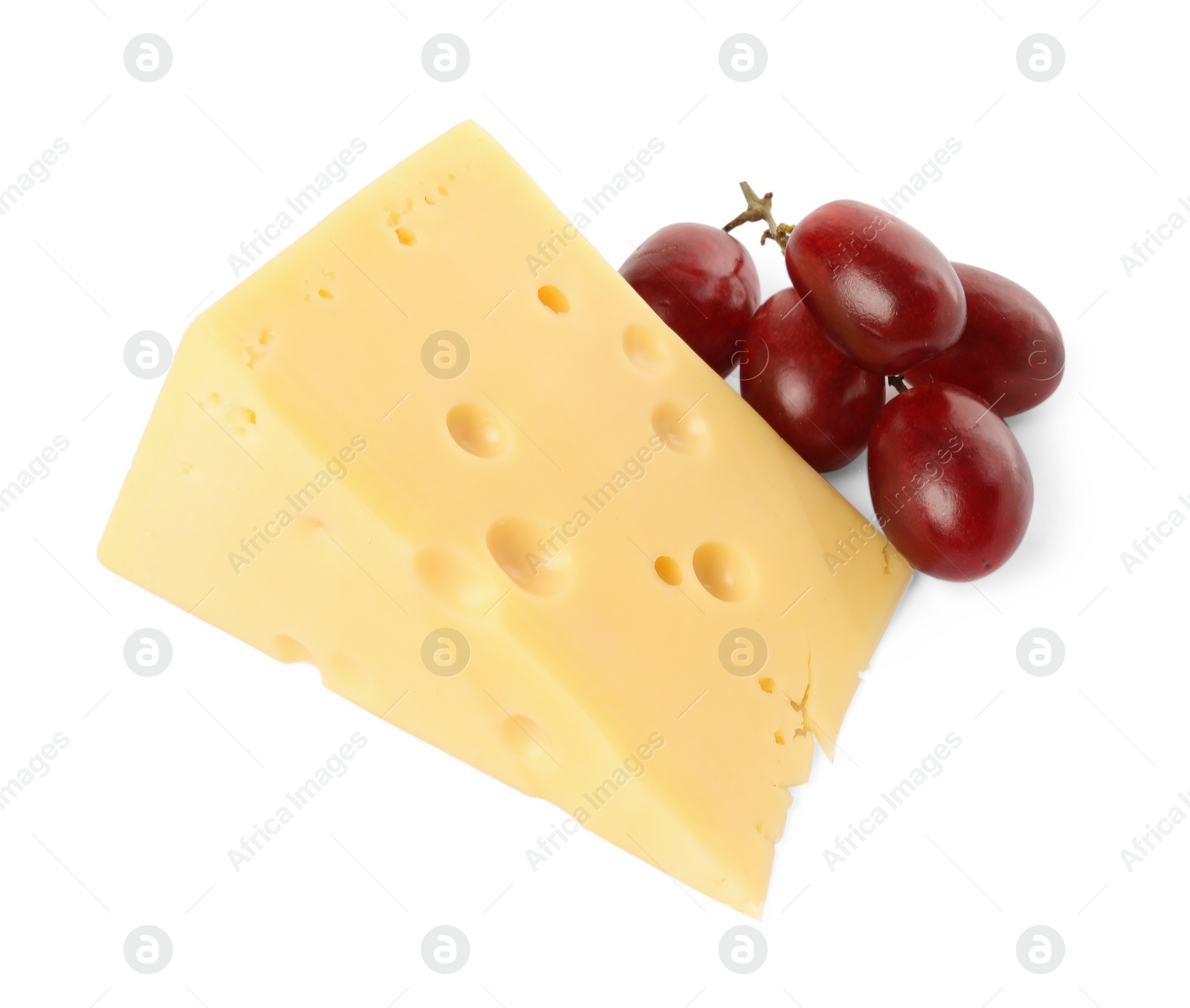 Photo of Piece of delicious cheese and grapes isolated on white