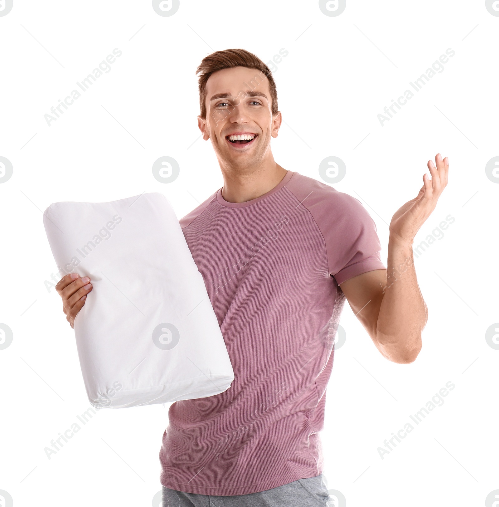 Photo of Young man in pajamas with pillow on white background