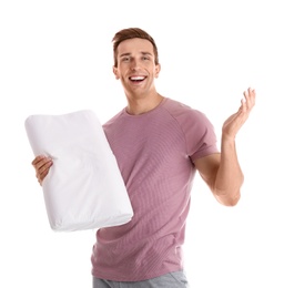 Photo of Young man in pajamas with pillow on white background