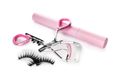 Photo of False eyelashes, curler and mascara on white background