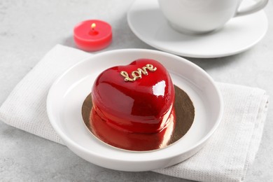 St. Valentine's Day. Delicious heart shaped cake served on light table, closeup