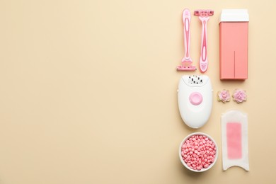 Photo of Set of epilation products on beige background, flat lay. Space for text