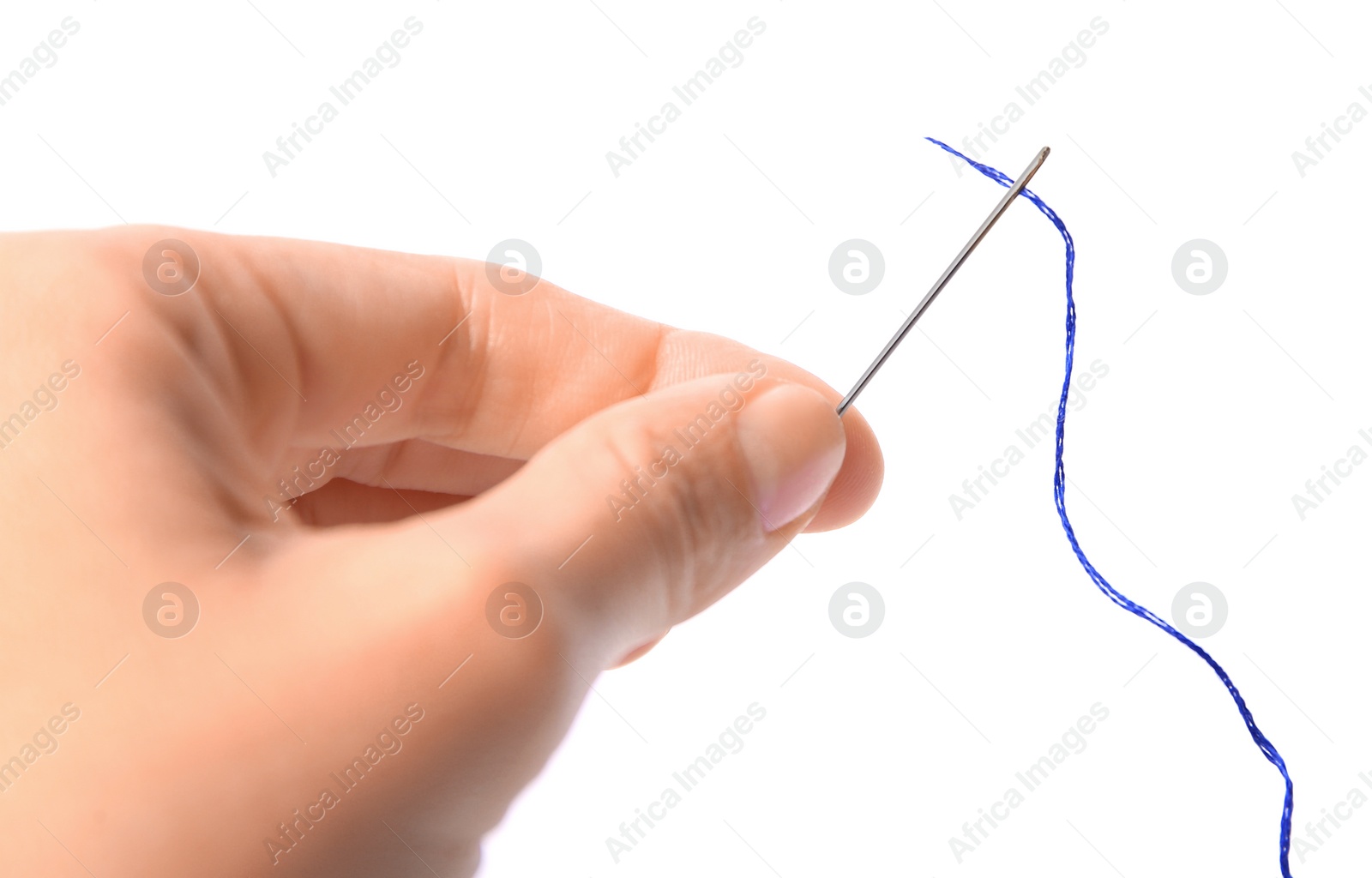 Photo of Woman holding sewing needle with thread on white background, closeup