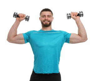 Handsome man exercising with dumbbells on white background