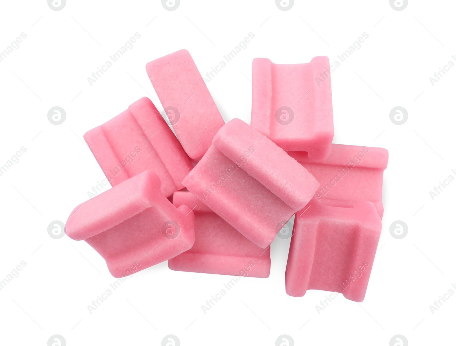 Photo of Tasty pink chewing gums on white background, top view