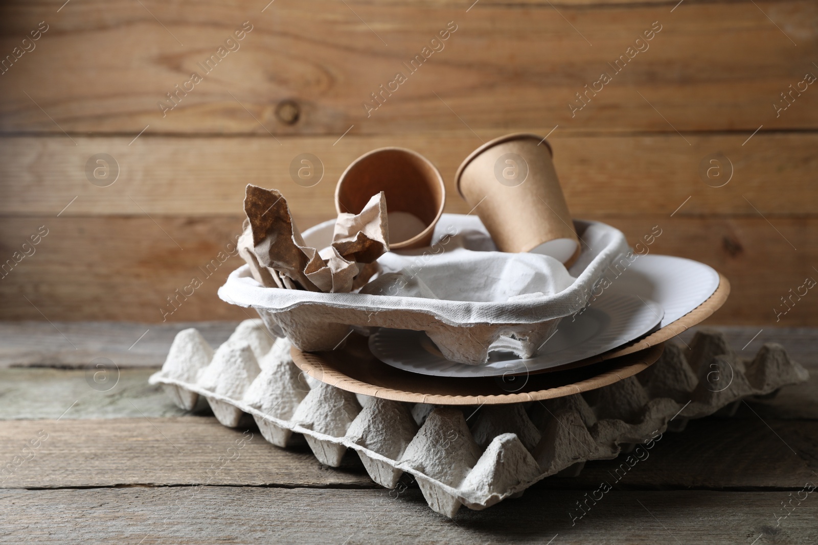 Photo of Stack of waste paper on wooden table