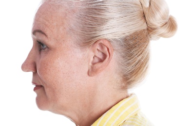 Mature woman on white background, closeup. Hearing problem