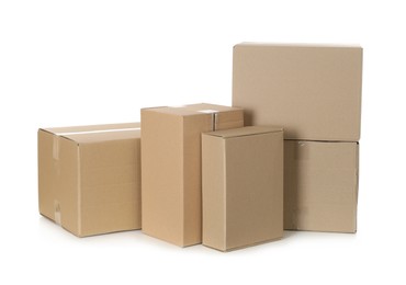 Photo of Pile of cardboard boxes on white background