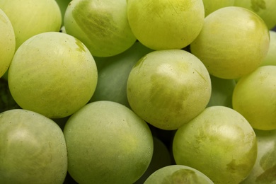 Photo of Bunch of green fresh ripe juicy grapes as background. Closeup view