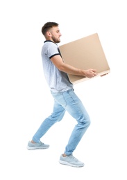 Photo of Full length portrait of young man carrying carton box on white background. Posture concept