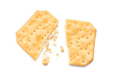Photo of Broken delicious crispy cracker isolated on white, top view