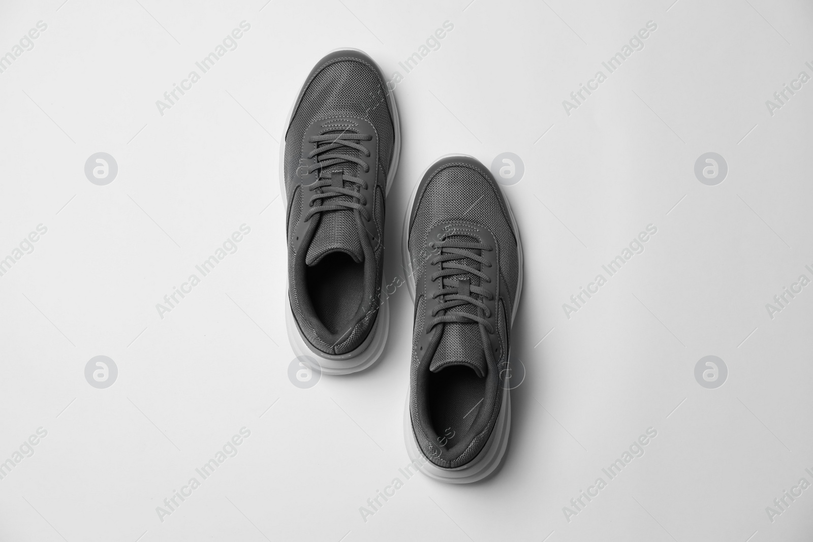Photo of Pair of stylish sport shoes on white background, flat lay
