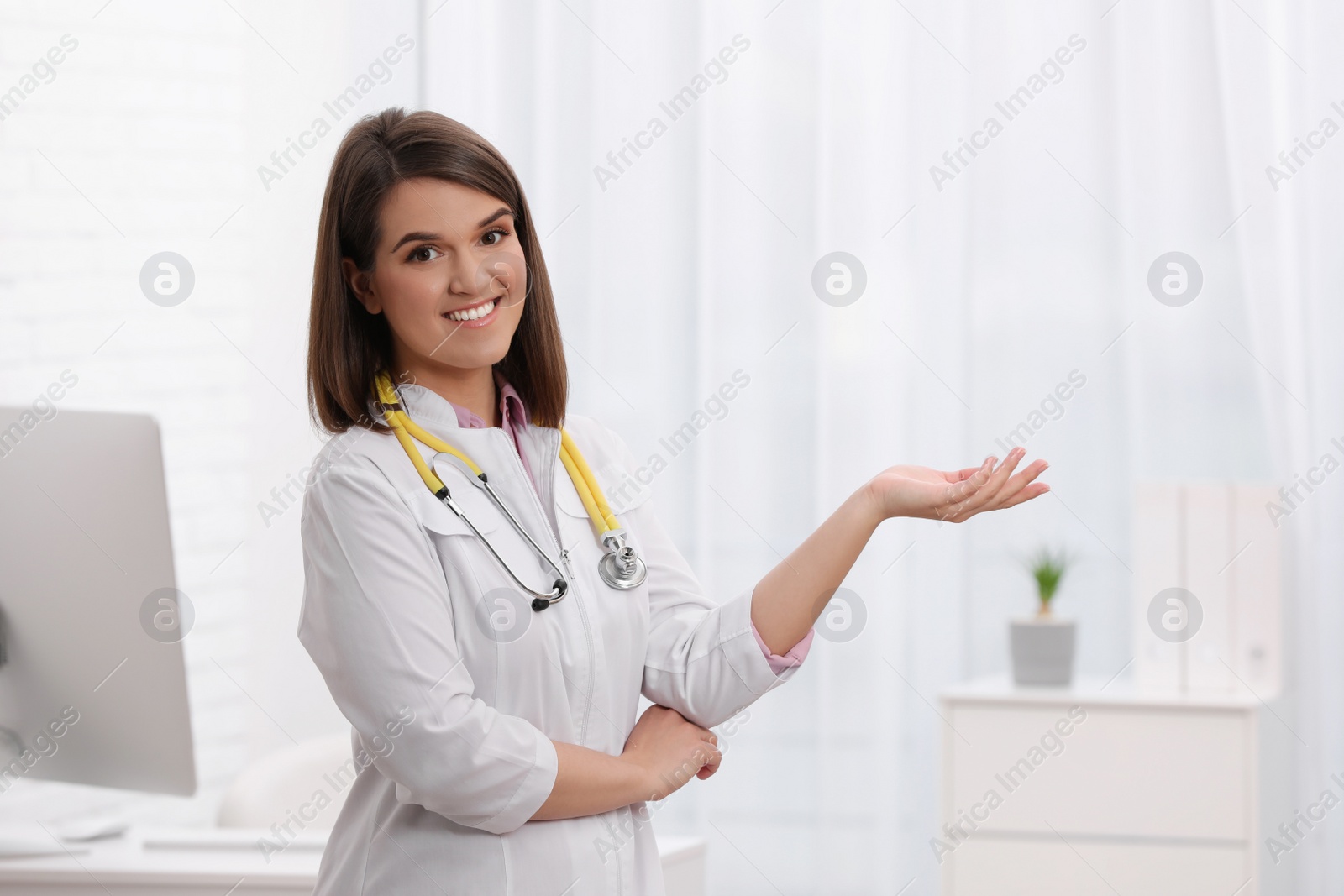 Photo of Portrait of pediatrician with stethoscope in clinic