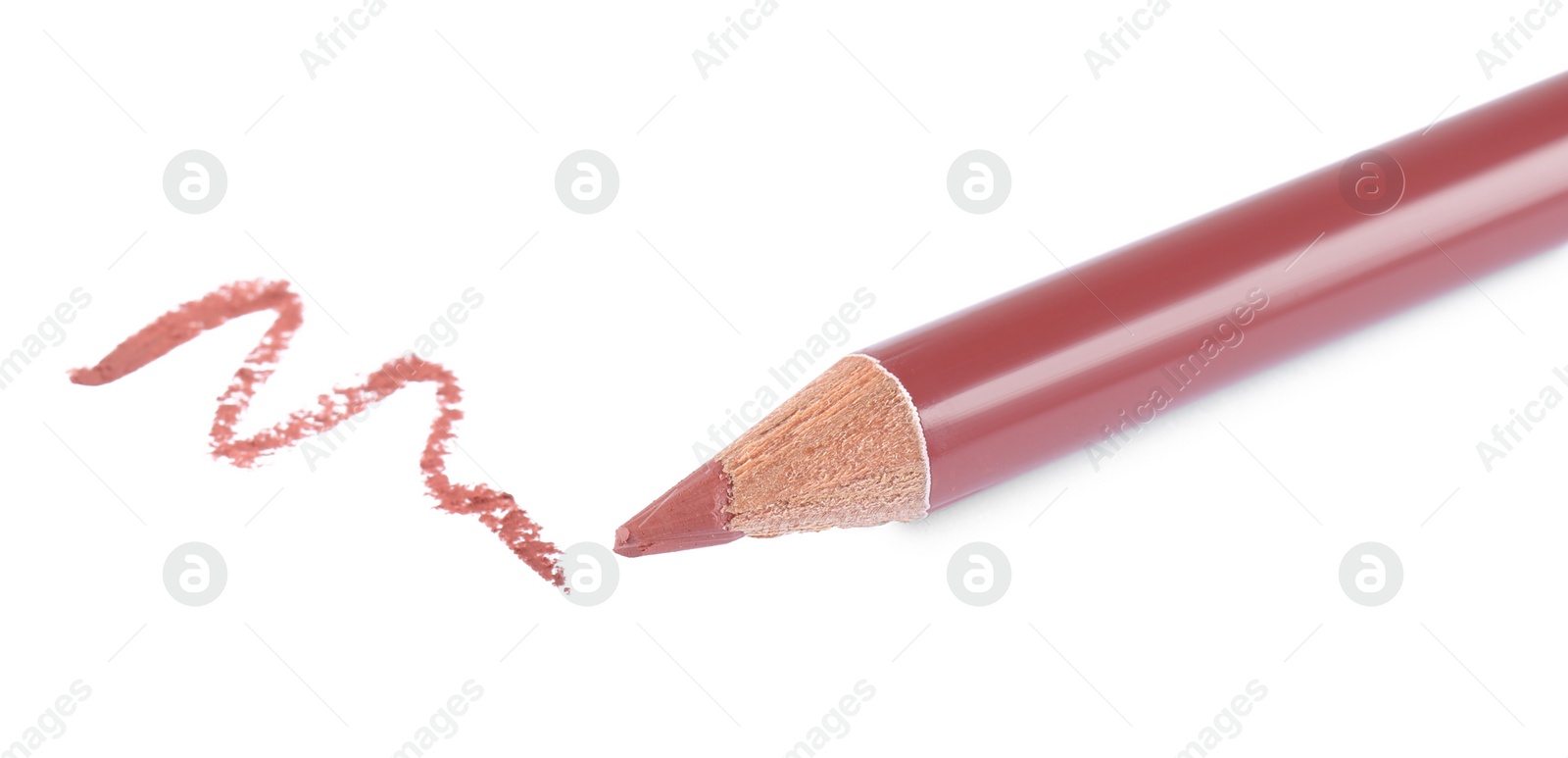 Photo of Bright lip liner stroke and pencil on white background