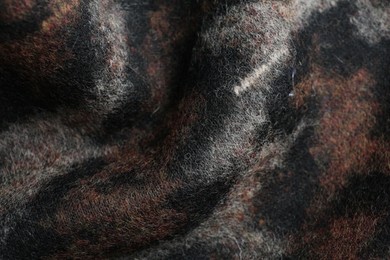 Texture of beautiful fabric with animal pattern as background, closeup