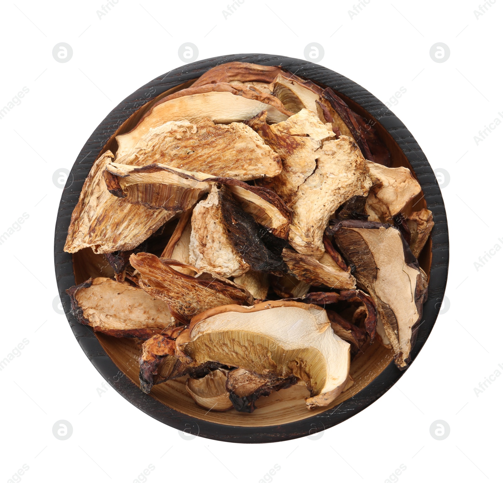 Photo of Bowl of dried mushrooms isolated on white, top view