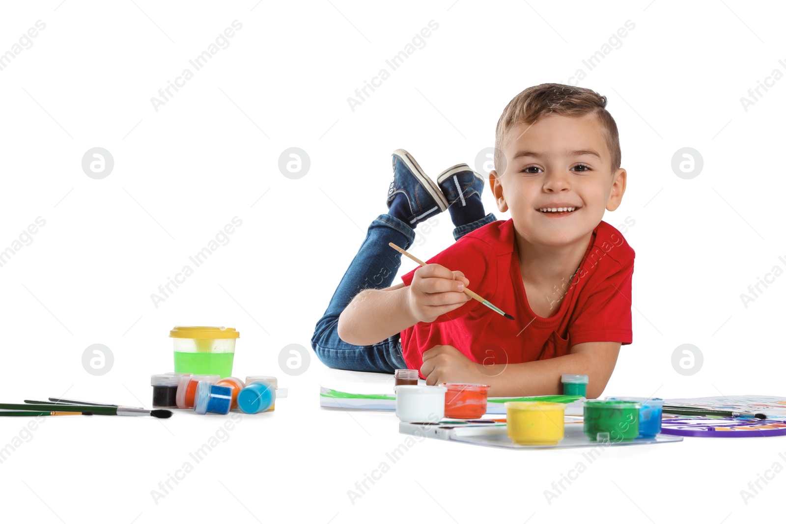 Photo of Cute child painting picture on white background