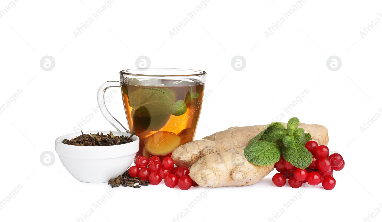 Photo of Glass cup of immunity boosting tea and ingredients on white background