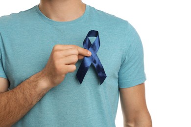 Photo of Man with blue ribbon on white background, closeup. Urology cancer awareness