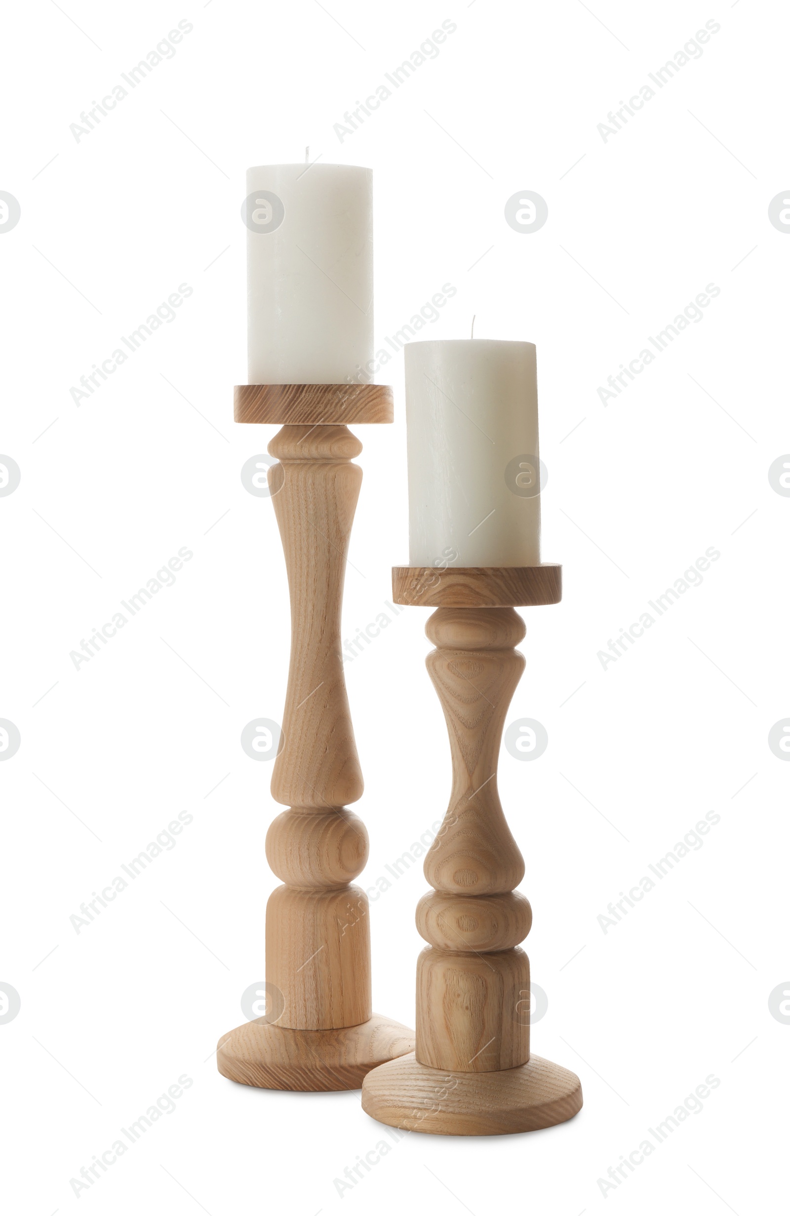 Photo of Elegant candlesticks with candles on white background