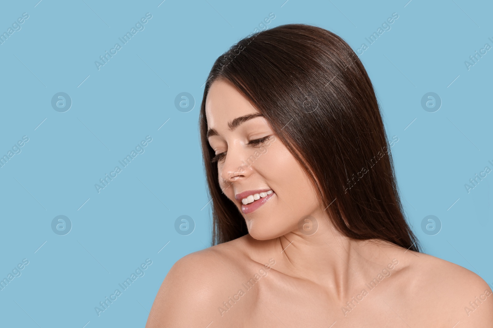 Photo of Portrait of attractive young woman on light blue background, space for text. Spa treatment