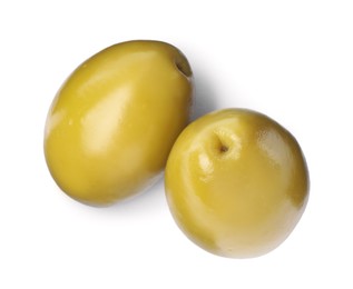 Photo of Two fresh green olives on white background, top view