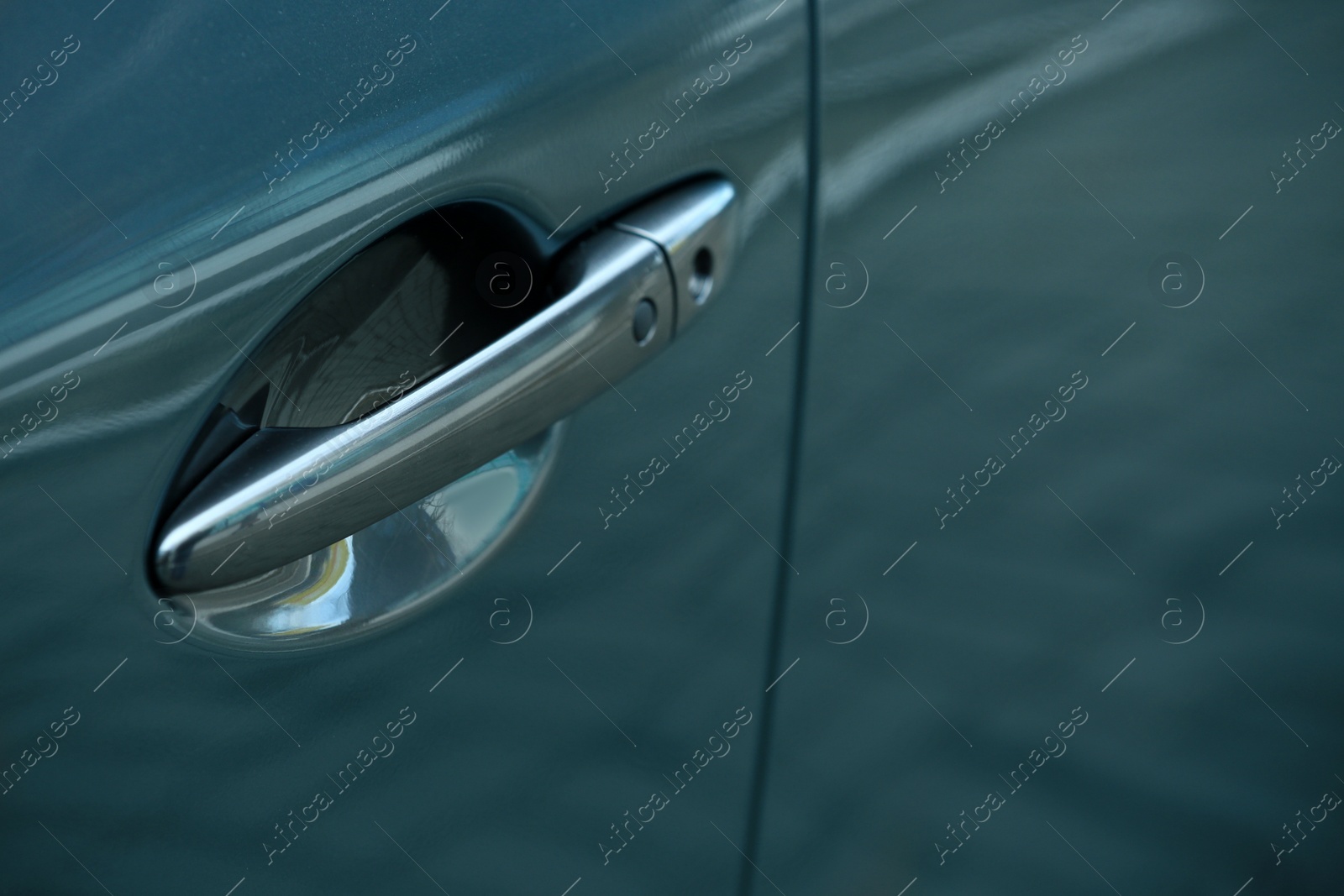 Photo of Closeup view of car door with handle