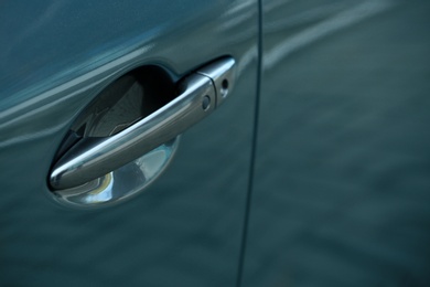 Closeup view of car door with handle