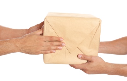 Photo of Courier giving parcel to client on white background, closeup