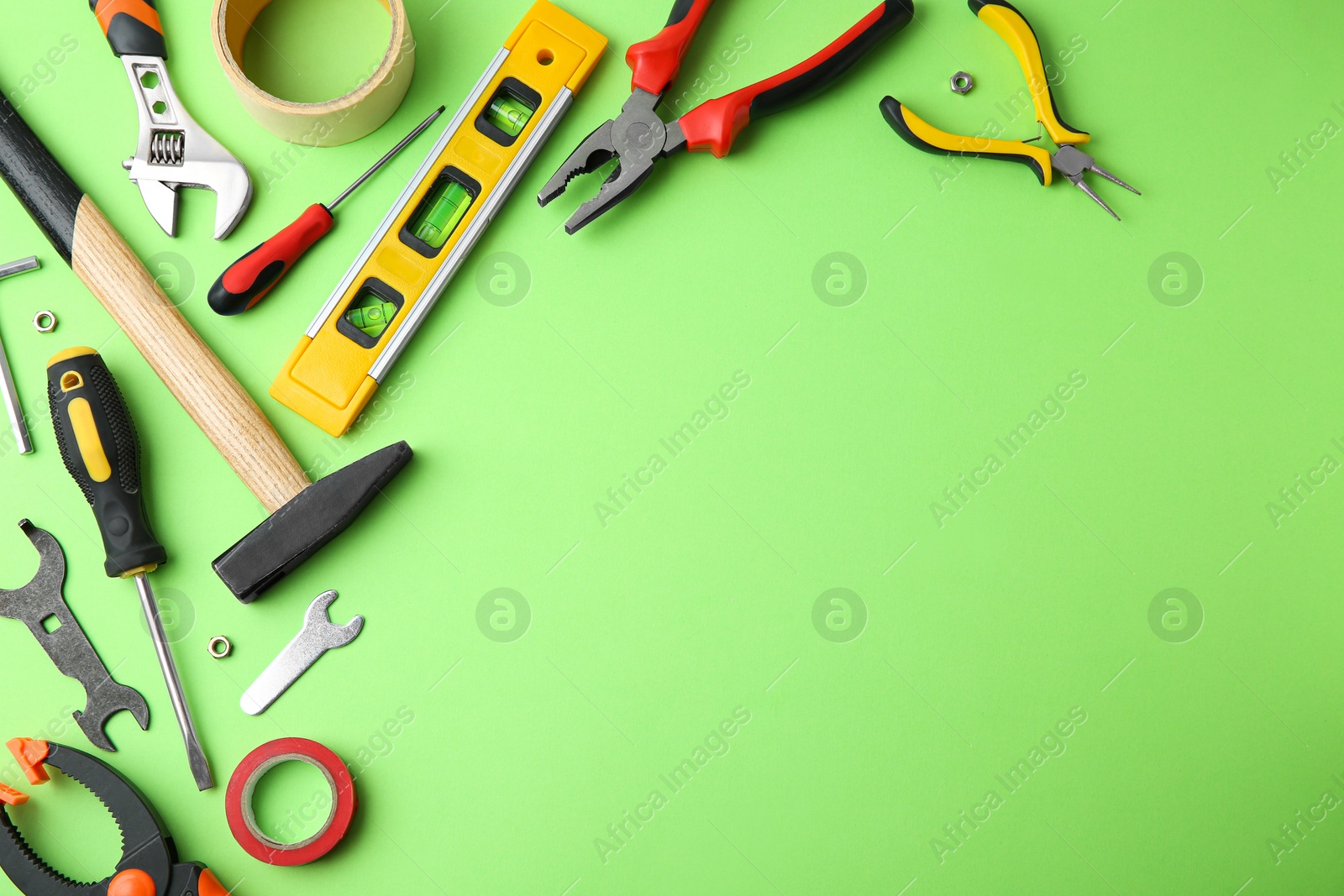 Photo of Set of repair tools on light green background, flat lay. Space for text