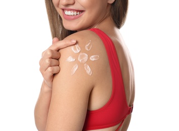 Woman with sun protection cream on body against white background, closeup