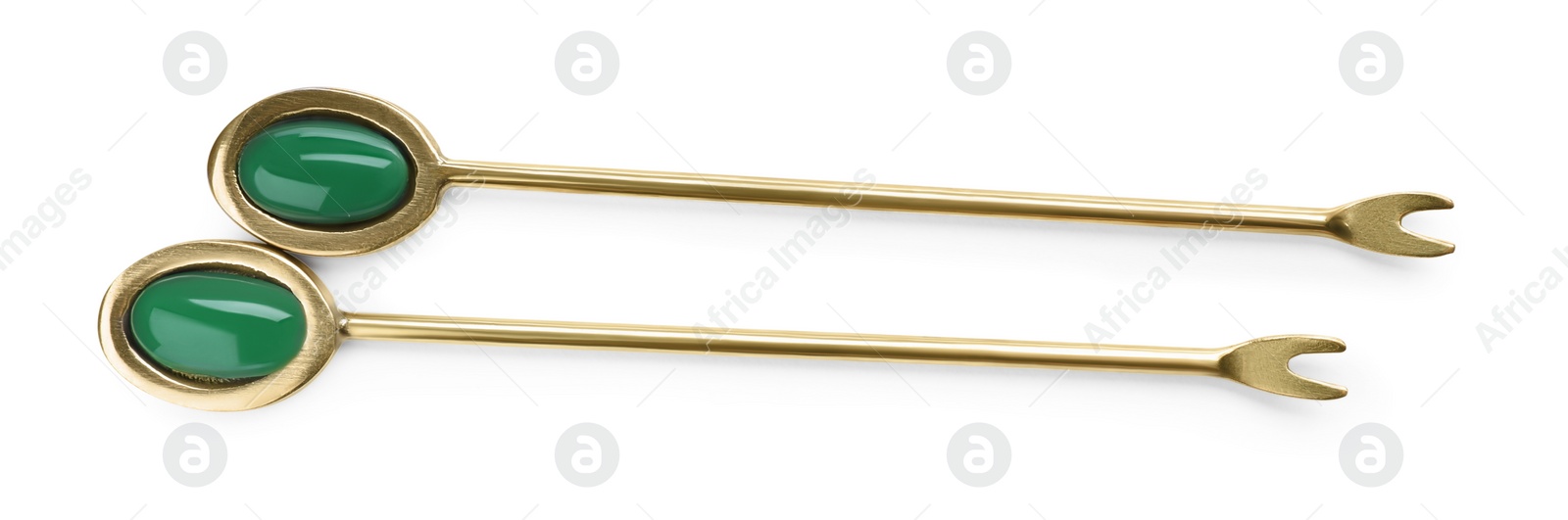 Photo of New stylish forks for canapes on white background