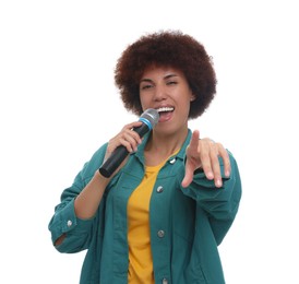 Photo of Curly young woman with microphone singing on white background