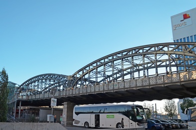 Photo of MUNICH, GERMANY - JUNE 23, 2018: Modern bridge over parking lot with cars