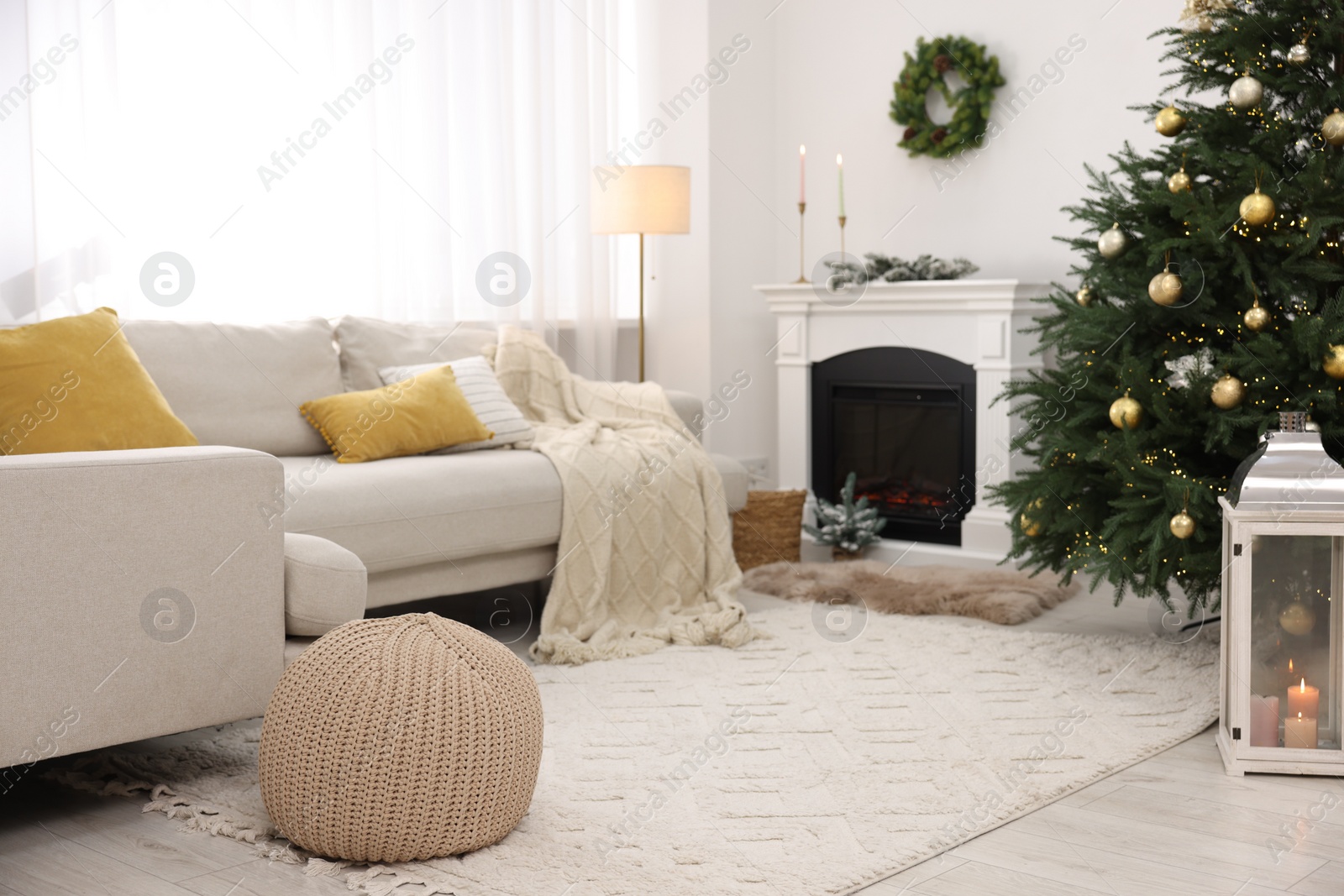 Photo of Christmas tree in furnished living room. Festive interior design