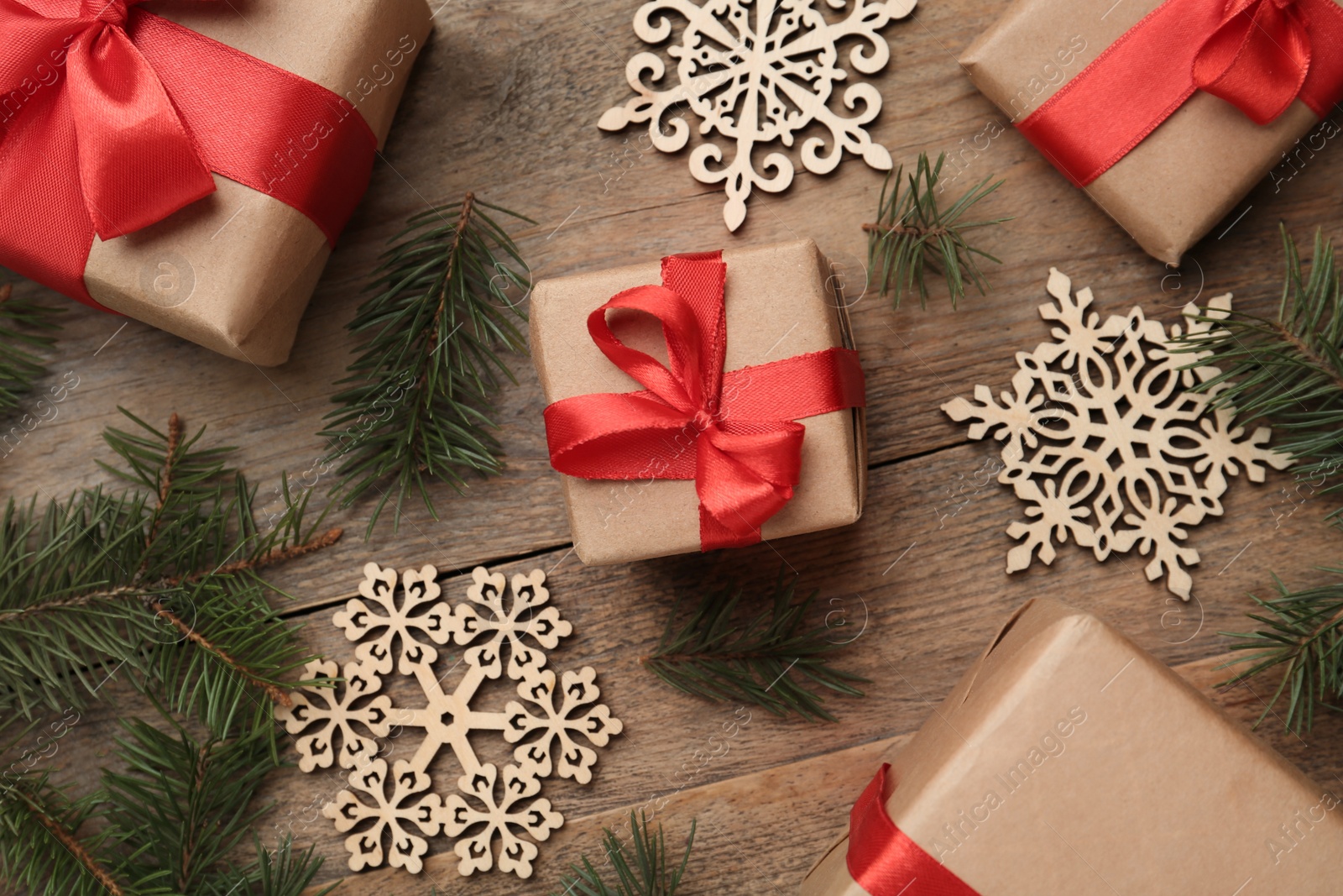 Photo of Flat lay composition with Christmas gifts on wooden table. Boxing day