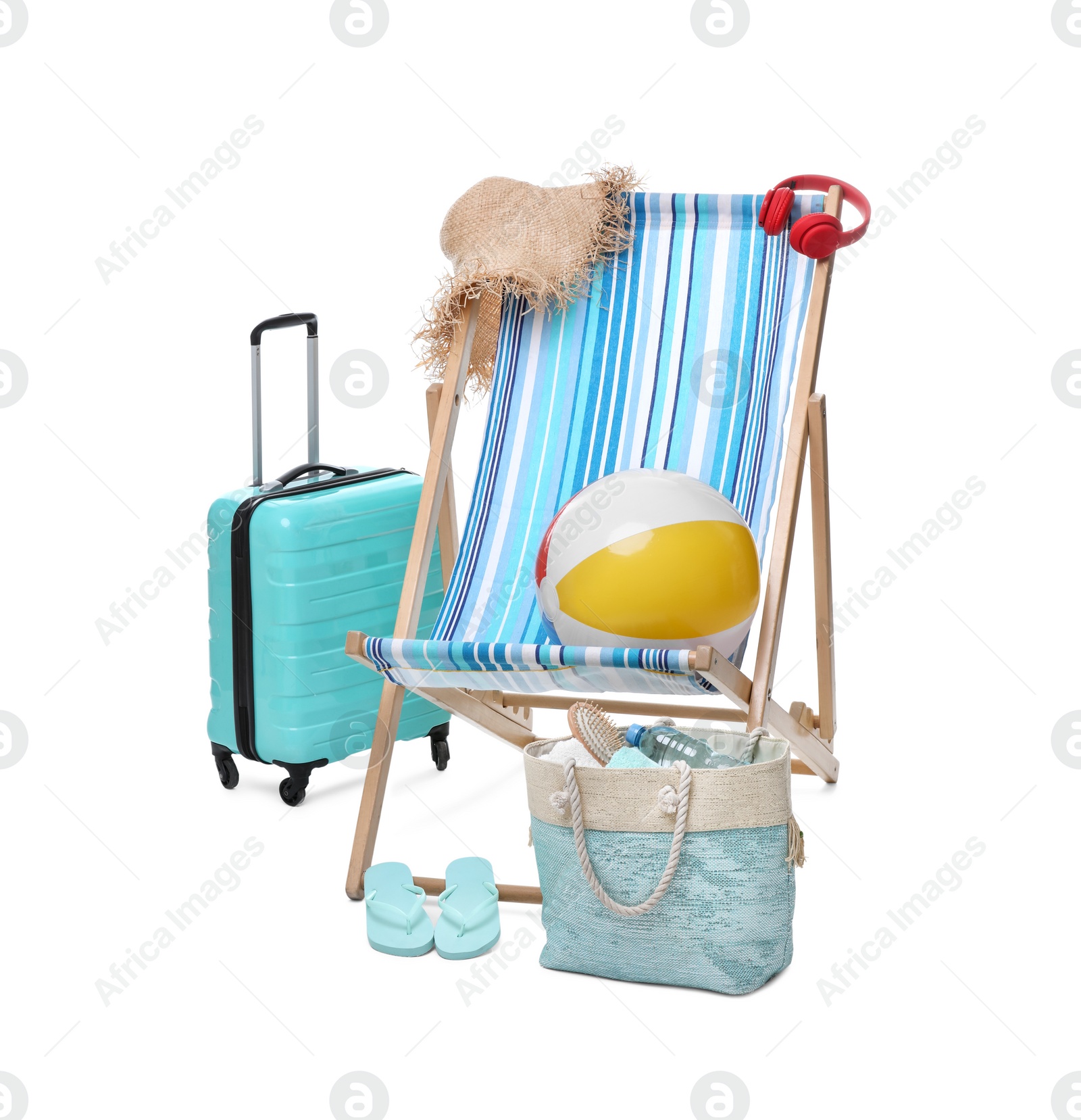 Deck chair, suitcase and beach accessories isolated on white Photo of Deck chair, suitcase and beach accessories isolated on white