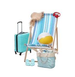 Photo of Deck chair, suitcase and beach accessories isolated on white