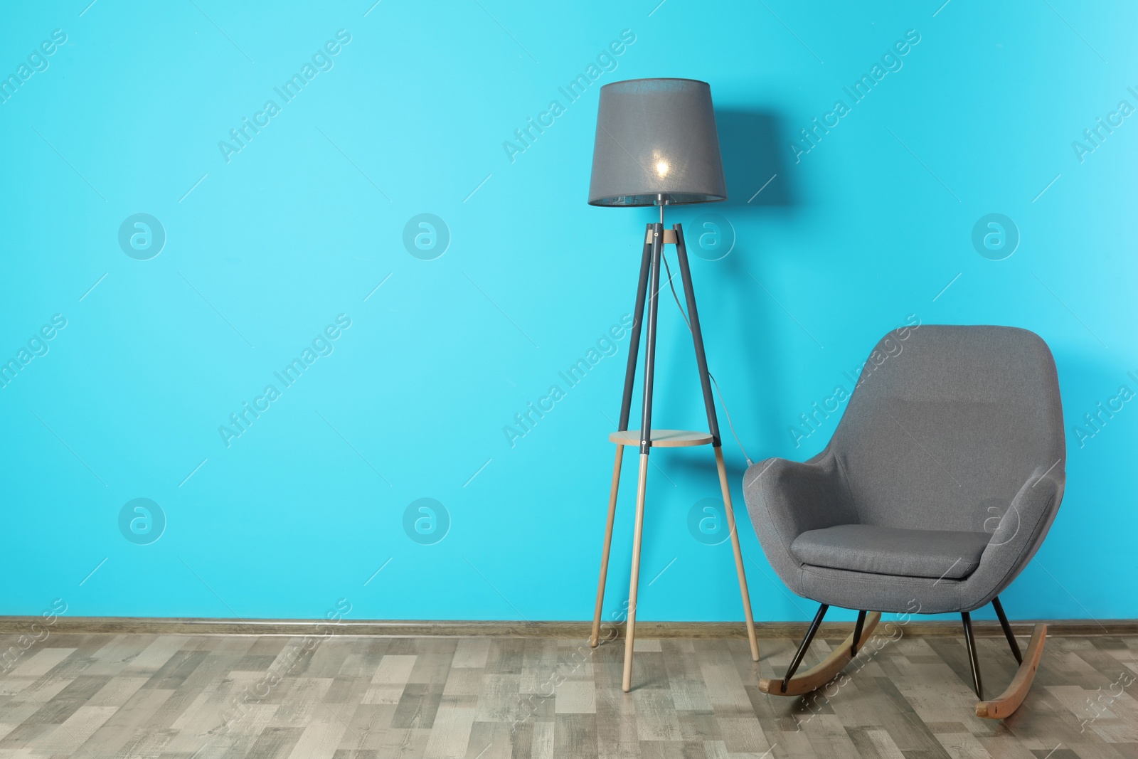 Photo of Comfortable rocking chair in stylish living room interior with space for text