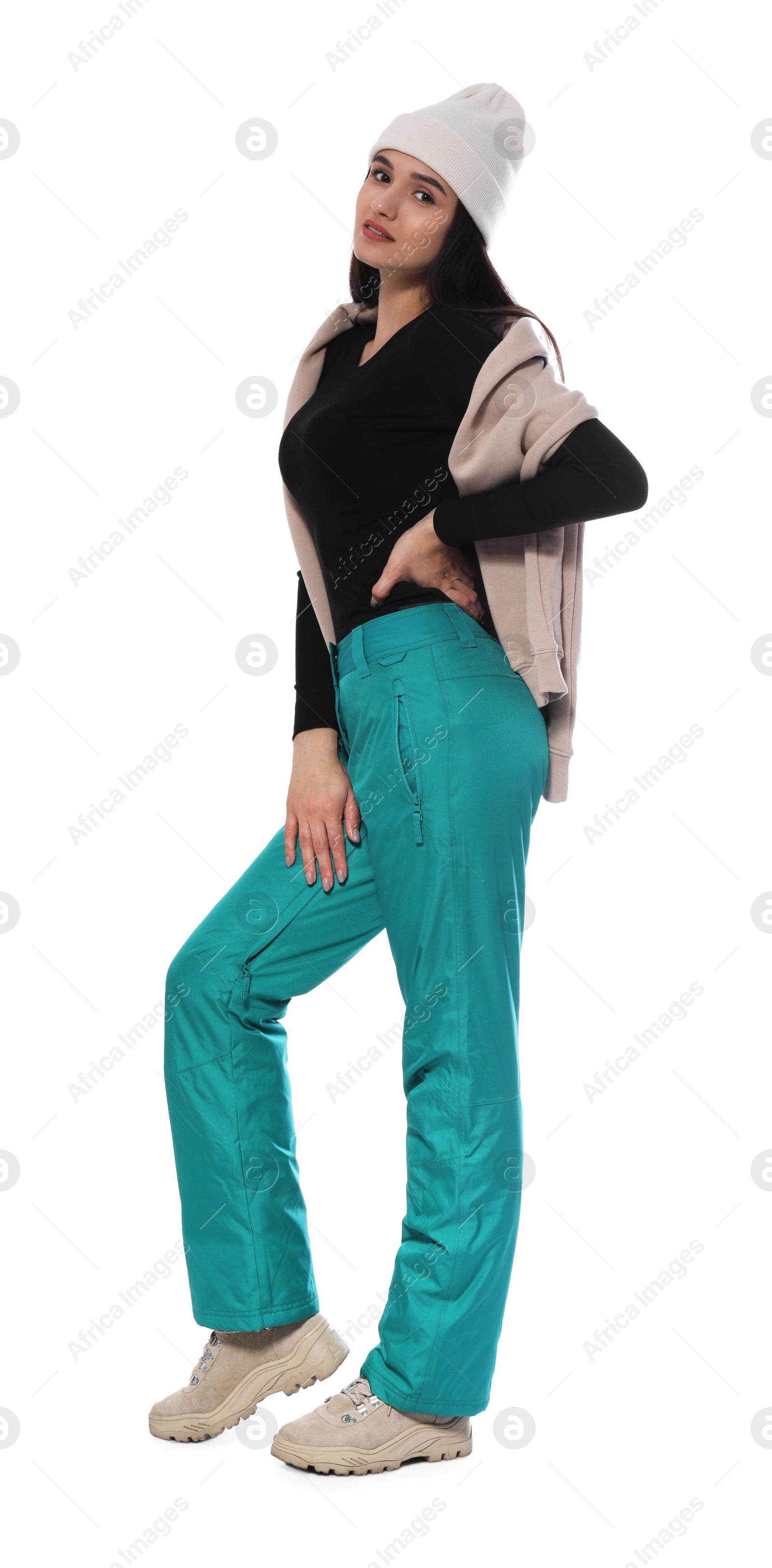 Photo of Woman wearing stylish winter sport clothes on white background