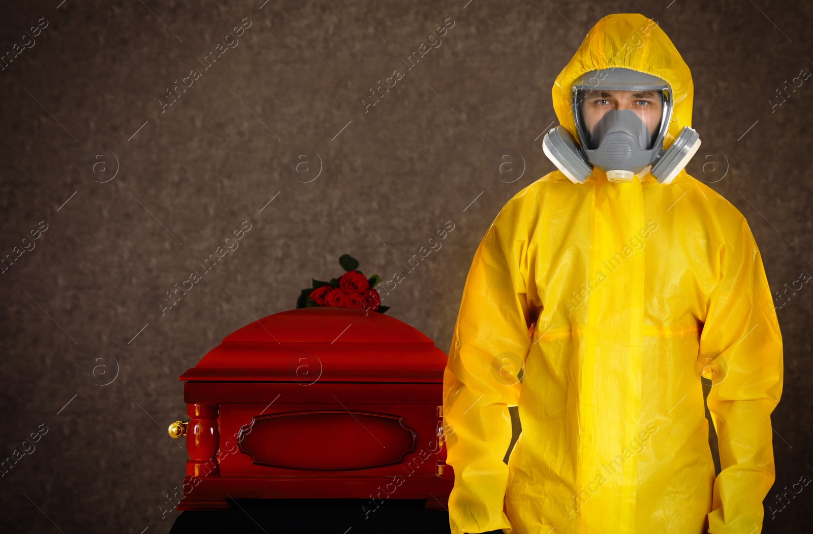 Image of Funeral during coronavirus pandemic. Man in protective suit near casket indoors