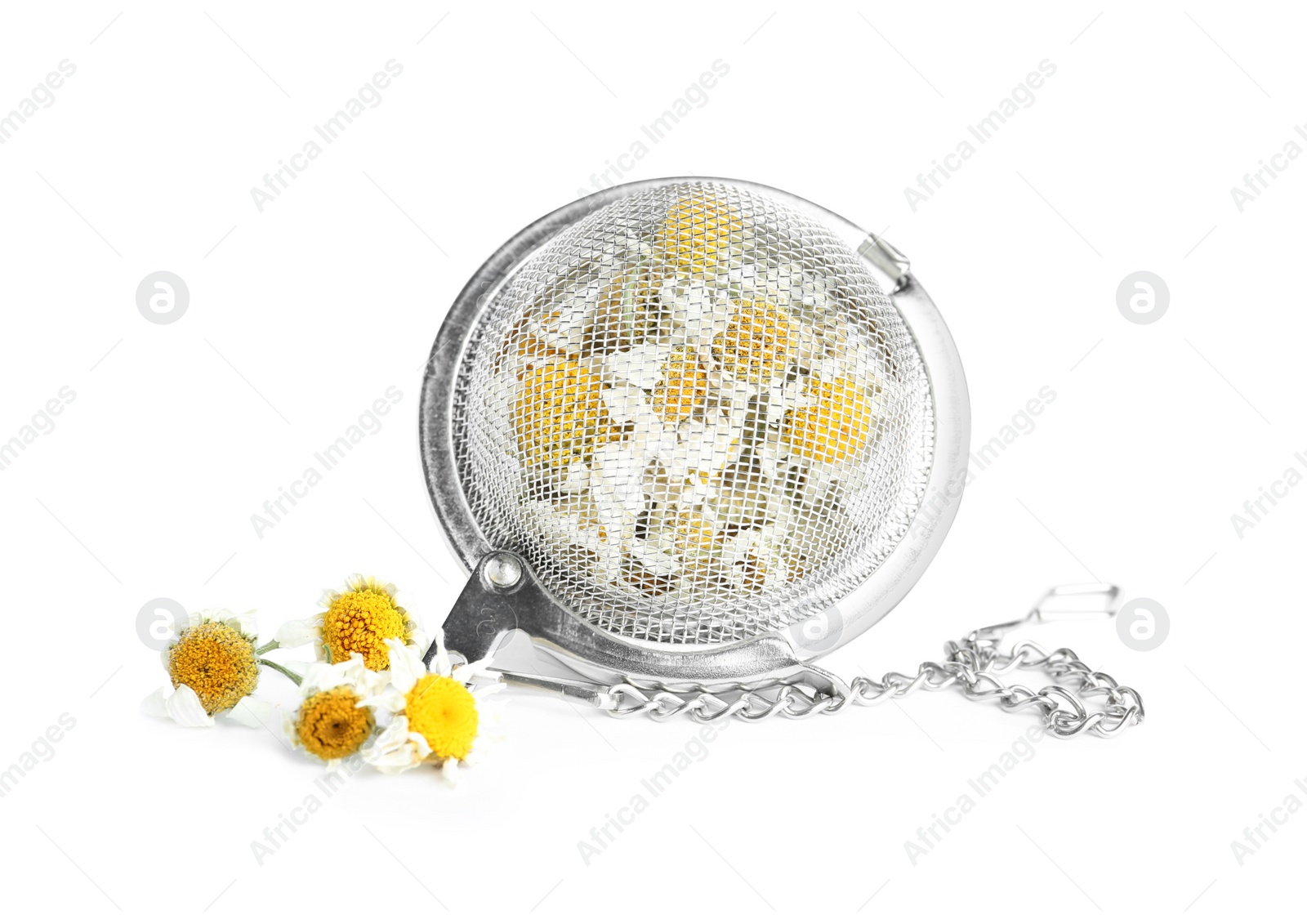 Photo of Dry chamomile flowers in infuser isolated on white