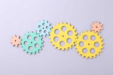 Photo of Business process organization and optimization. Scheme with colorful figures on light background, top view