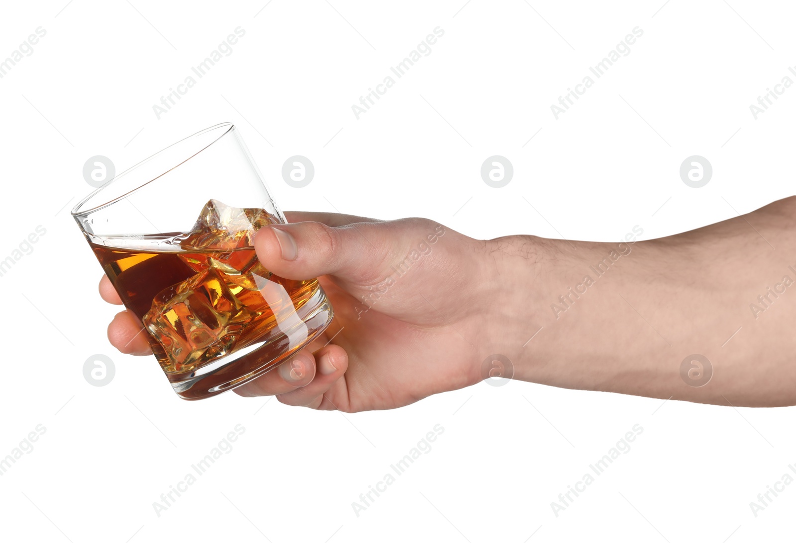 Photo of Man holding glass of whiskey with ice cubes on white background, closeup