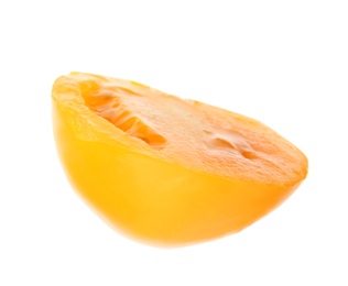 Slice of yellow tomato on white background