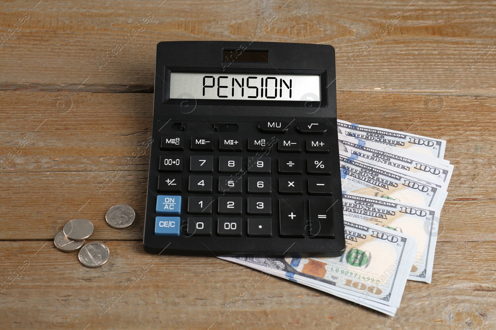 Image of Calculator with word Pension and money on wooden table