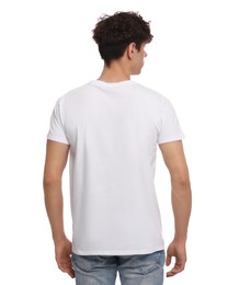 Man wearing stylish t-shirt on white background, back view. Mockup for design