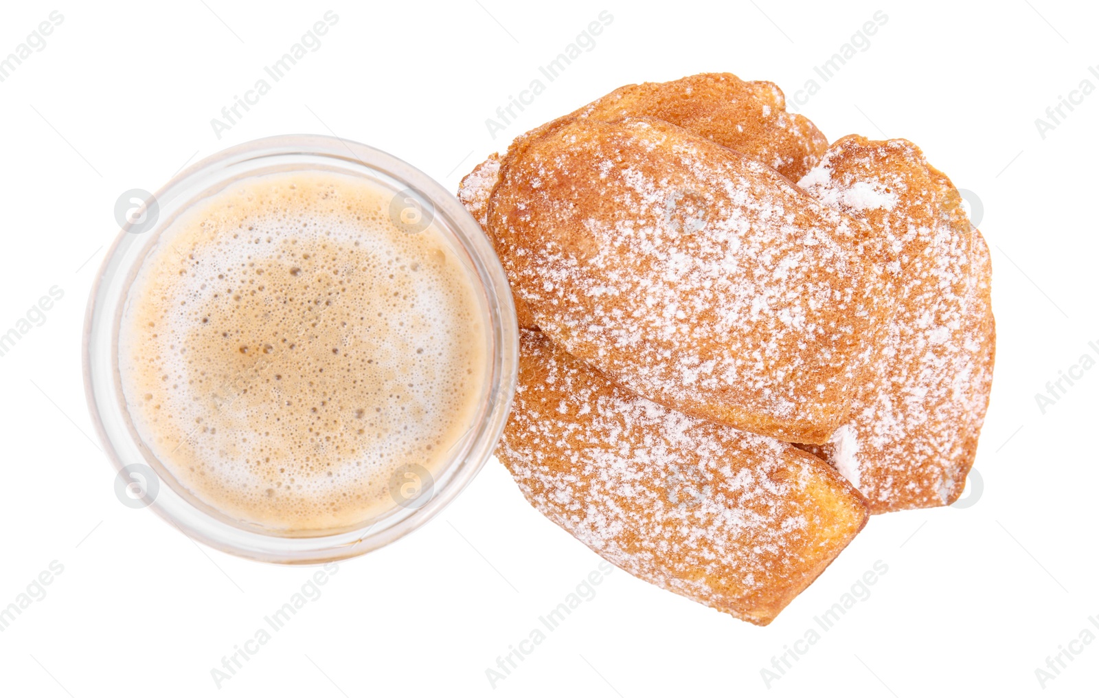 Photo of Delicious madeleine cakes with powdered sugar and glass of latte on white background, top view