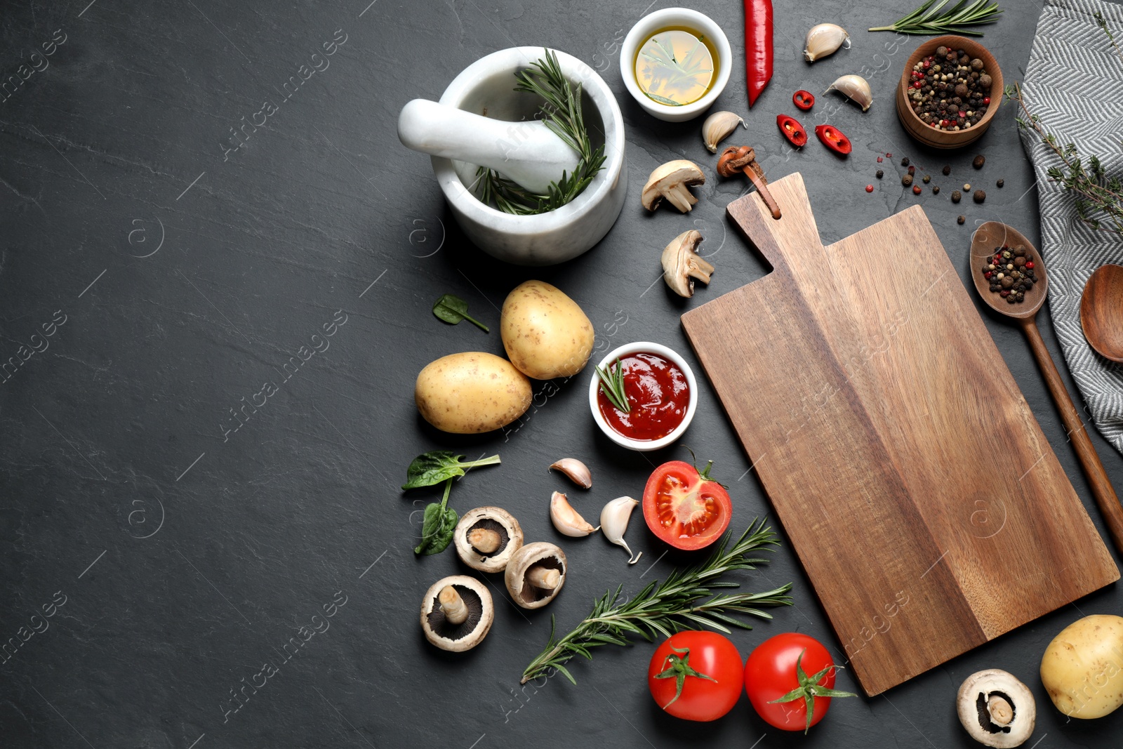 Photo of Flat lay composition with fresh products on black table, space for text. Healthy cooking