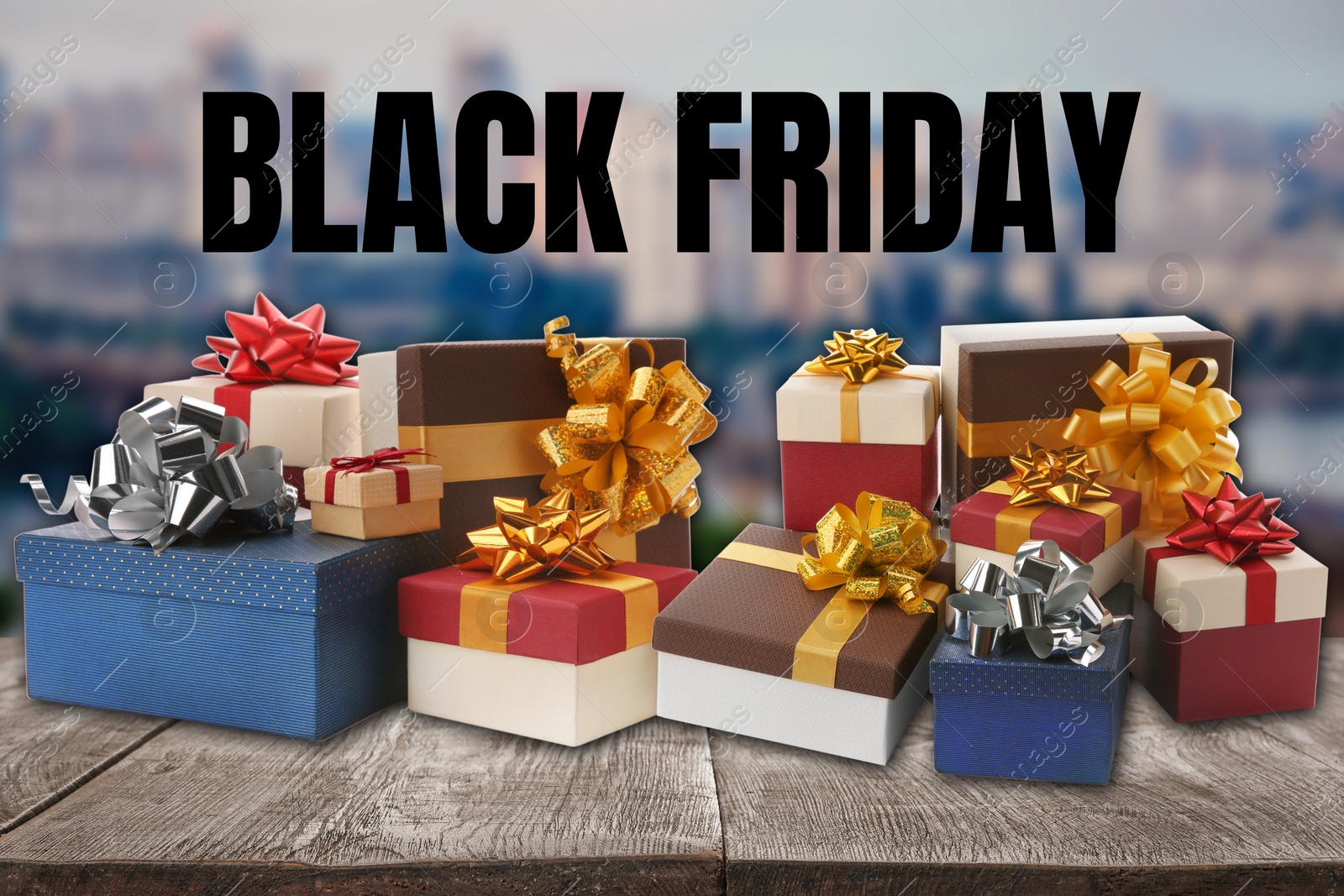 Image of Black Friday. Many gift boxes on wooden surface